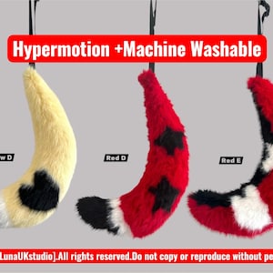 May include: Three faux fur tails hanging vertically, labeled Yellow D, Red D, and Red E. The yellow tail has black markings, the red tails feature black star and white cross patterns. Text reads: Hypermotion +Machine Washable and [2026][LunaUKstudio].All rights reserved.Do not copy or reproduce without permission.