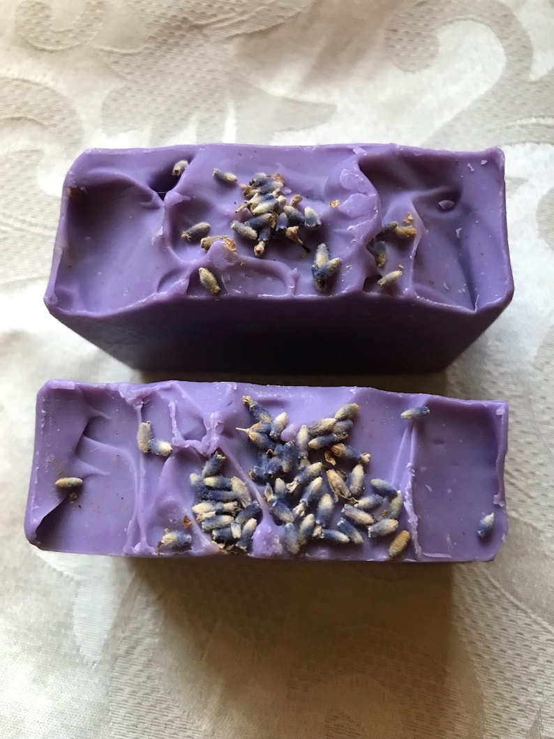 This is a purple lavender essential oil scented soap and has lavender buds on top of it. It is 5.5 oz and is $7