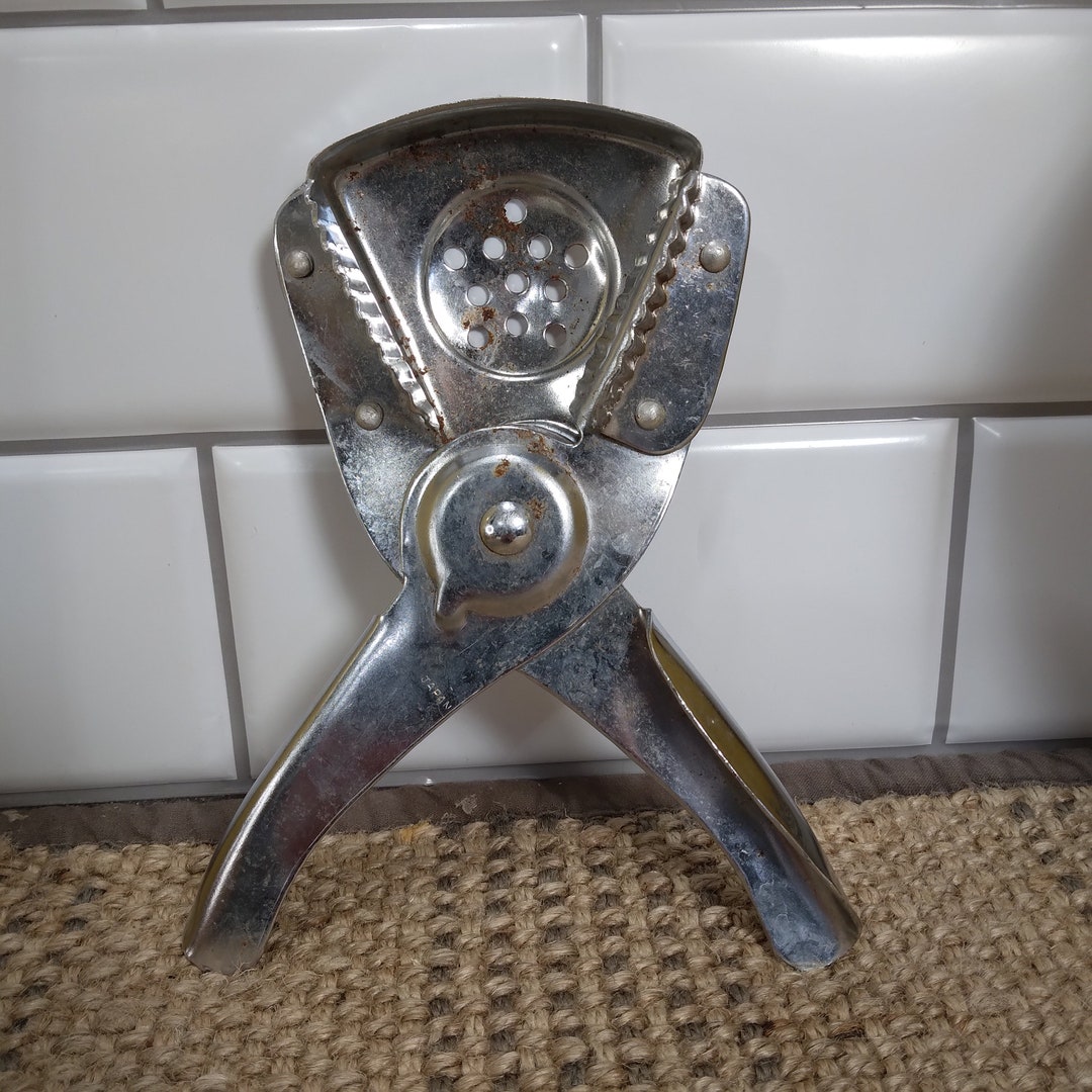 Curated visual reference: Visual Reference: Hand Held Manual Citrus Juicer Or Garlic Press