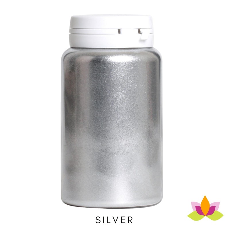 May include: A silver metallic pigment in a white plastic bottle with a white lid. The bottle is labeled "SILVER".