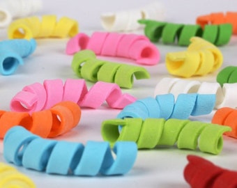 May include: Assortment of colorful, coiled, plastic pipe cleaners in various colors, including pink, orange, yellow, green, blue, and red.