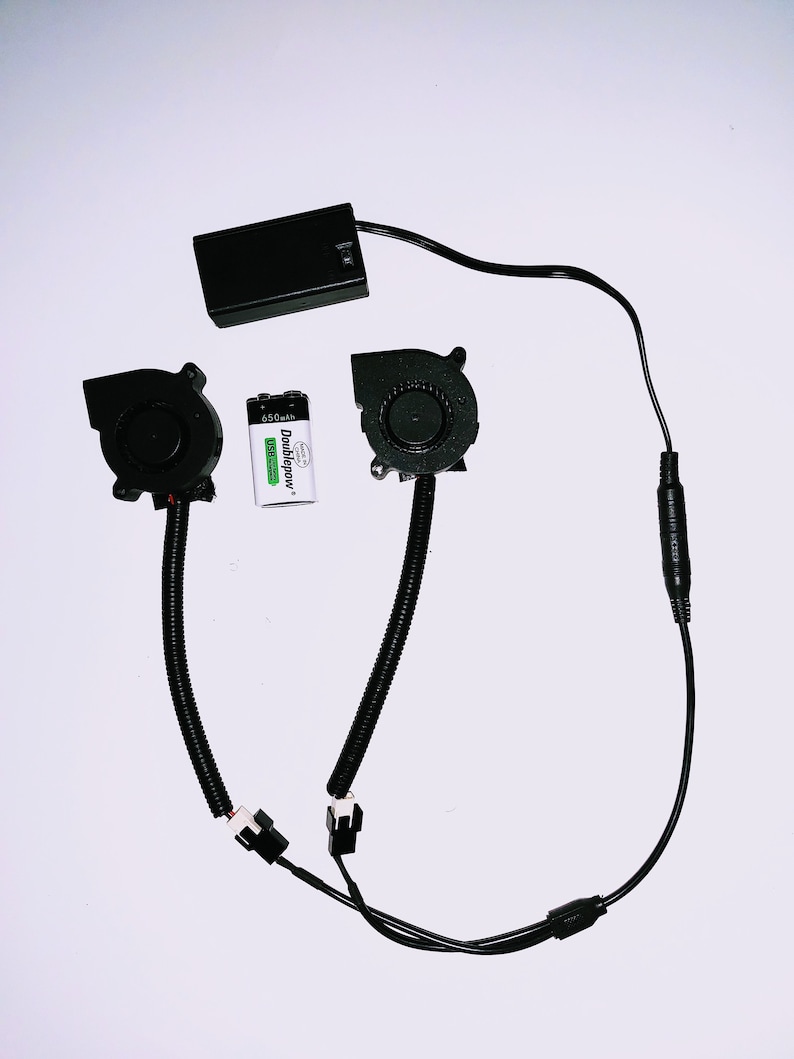 May include: Two black cooling fans with black wires and connectors, a black battery pack, and a 6.50 mAh Doublepower battery.