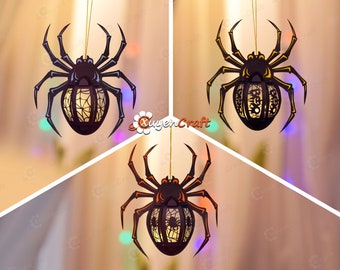 May include: Three black spider-shaped Halloween decorations with intricate cut-out designs. Each spider has a light inside and hangs from a string.