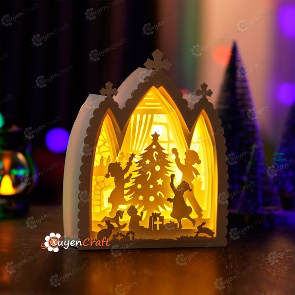 Scene of children decorating a Christmas tree in Nativity House Shadow Box PDF, SVG Light Box for Cricut Projects - DIY Paper Lantern Scene of children decorating a Christmas tree in Nativity House Shadow Box PDF, SVG Light Box for Cricut Projects - DIY Paper Lantern