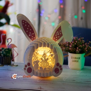 PDF, SVG, Studio modèle lapin assis oeuf dans les oeufs de lapin de Pâques pop up - boîte d’ombre de Pâques, papier artisanat Pâques, SVG pour les projets Cricut