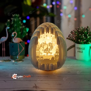 Père Noël donne cadeau Noël oeufs Pop Up boîte à lumière SVG modèle papier découpé Cricut projets 3d shadow box, sphère svg, bricolage oeufs 3d svg