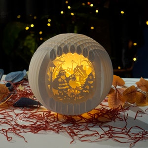 3D Pop Up SVG Templates créant La sphère du Père Noël pop-up pour Joyeux Noël | Cadeaux de Noël DIY, Boîte à lumière Papercut, Kirigami DIY