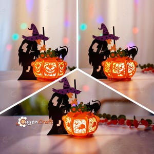 Pode incluir: Uma lanterna de papel iluminada com tema de Halloween apresenta uma bruxa mexendo um caldeirão com um gato preto. O caldeirão tem a forma de uma abóbora com um rosto de abóbora esculpido. A lanterna é iluminada por dentro, projetando um brilho quente.
