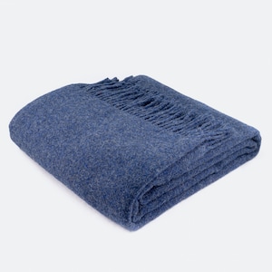 100% sheep wool blanket in blue. Warm mustard yellow wool plaid. High quality wool sofa throw in pistachio. Cozy natural bed blanket in grey