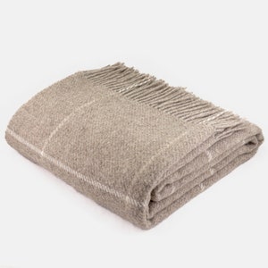 Nice wool blanket in beige. Blue wool plaid. High quality 100% wool sofa throw in pistachio. Cozy natural bed blanket in grey
