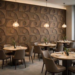 May include: Interior of a restaurant with round tables and brown chairs. The tables have light wood tops and dark bases. The backdrop is a textured wooden wall with a repeating geometric pattern. Pendant lights hang above the tables, creating a warm atmosphere.