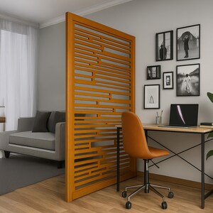 Custom wooden room divider wall panel with frame and intricate design which has elegant finish in home office space