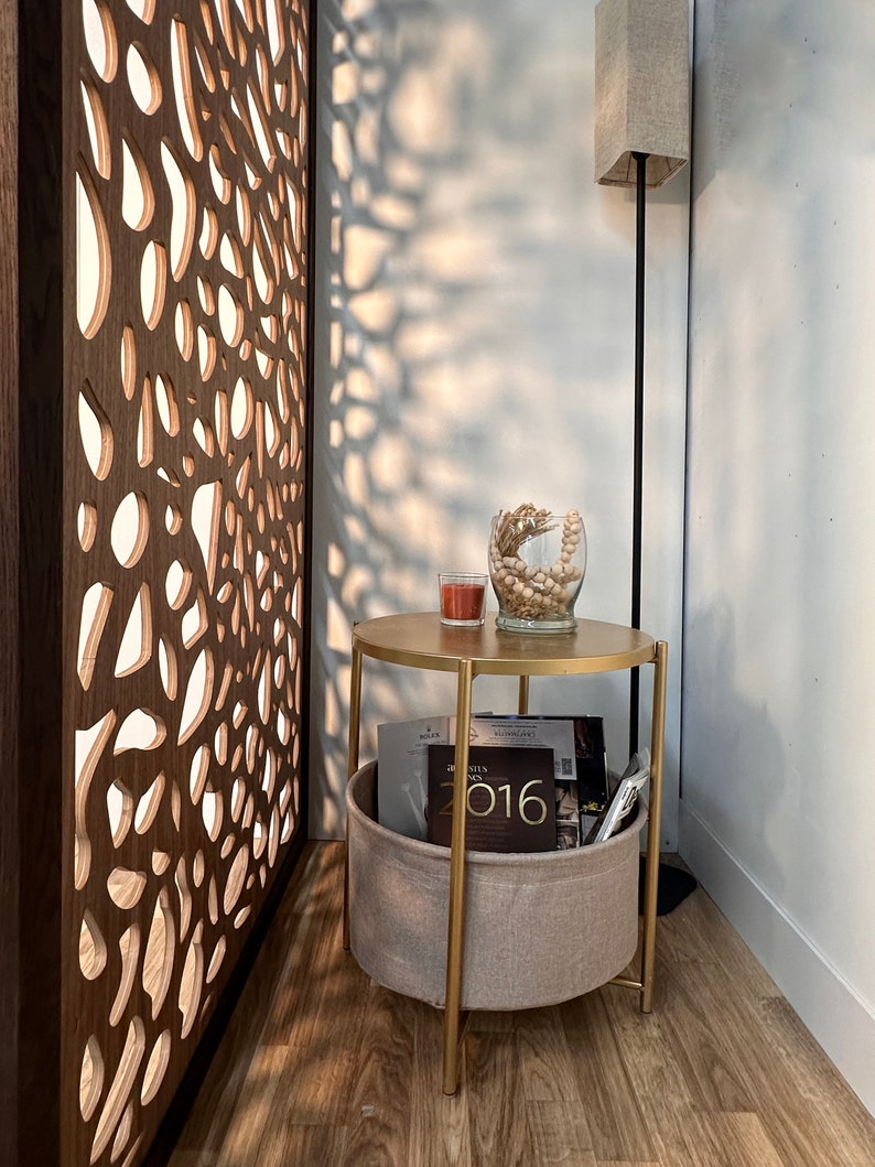 Custom wooden room divider wall panel with frame and intricate design which has elegant finish