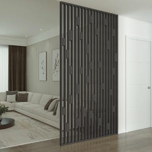 Modern living room with a black geometric slatted partition, neutral-toned sectional sofa, decorative wall art, and large windows with natural light.
