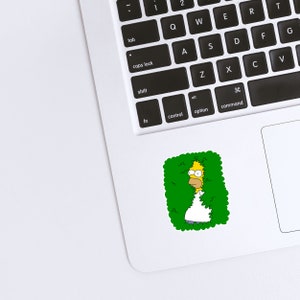 May include: A yellow cartoon character with spiky hair is peeking out from behind a green bush. The character is wearing a white shirt and has a surprised expression on their face.