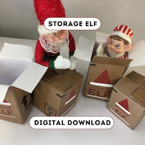 May include: A Christmas-themed image showing a Santa Claus figure and an elf doll inside open cardboard boxes. The boxes are decorated with a red Santa hat design and the words "STORAGE ELF". The text "DIGITAL DOWNLOAD" is also visible.