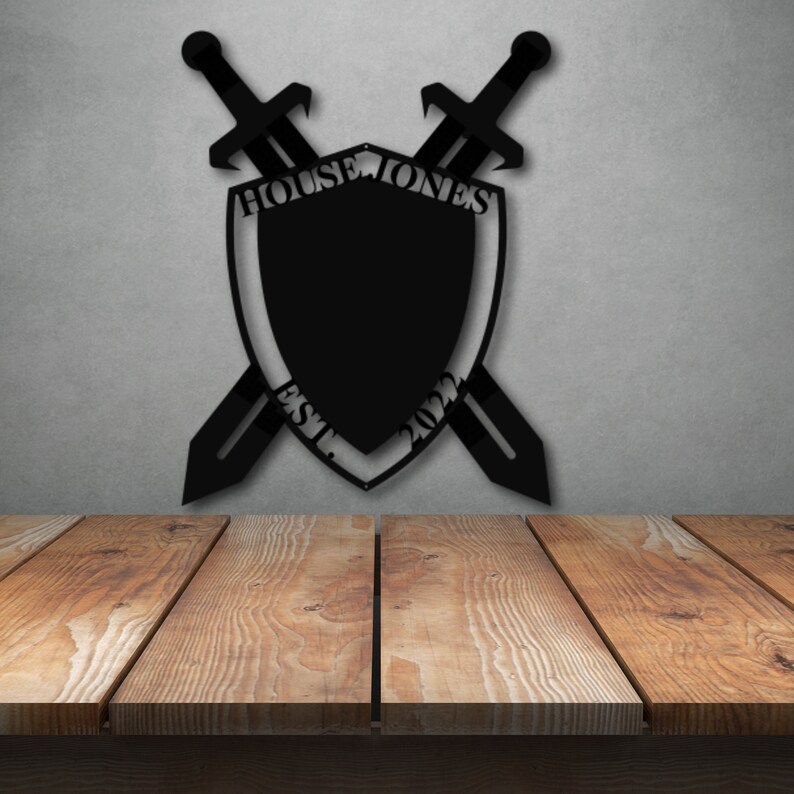 May include: Black metal shield with crossed swords, featuring the text "House Jones Est. 2022".