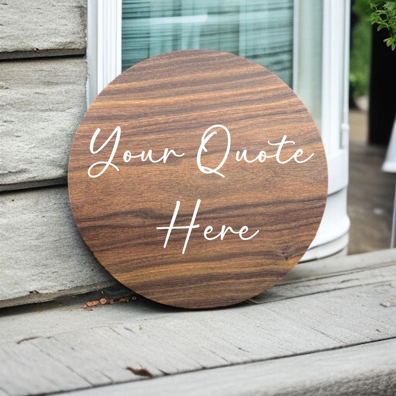 May include: A round wooden sign with the text "Your Quote Here" written in white cursive font.