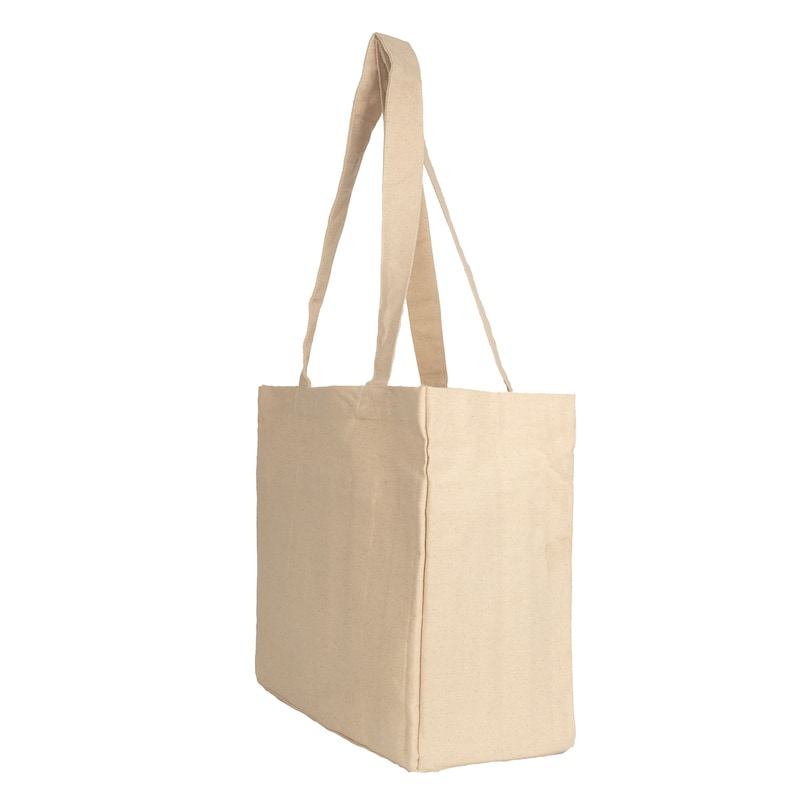 May include: A beige canvas tote bag with two long handles. The bag is empty and has a rectangular shape.