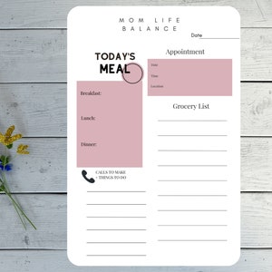 Puede incluir: Una página de planificador imprimible con el título "Equilibrio de la vida de mamá". La página incluye secciones para "La comida de hoy", "Cita", "Lista de la compra" y "Llamadas a realizar/Cosas que hacer".