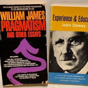 May include: Two paperback books titled Pragmatism and Other Essays by William James and Experience & Education by John Dewey. The first book has a black cover with yellow and white text and a purple arrow. The second book features a portrait.