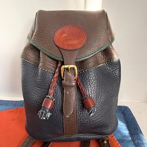 Dooney & Bourke Vintage USA 90s Teton Small Backpack Drawstring  Bucket Pebbled Leather Dark Navy Taupe Shoulder Bag Tote Unisex