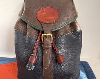 dooney mini leather backpack buckle Pebble Grain Zip Pod & Bourke made from special Italian Vacchetta leather that grows softer the more you carry it Vintage 90's Dooney & Bourke