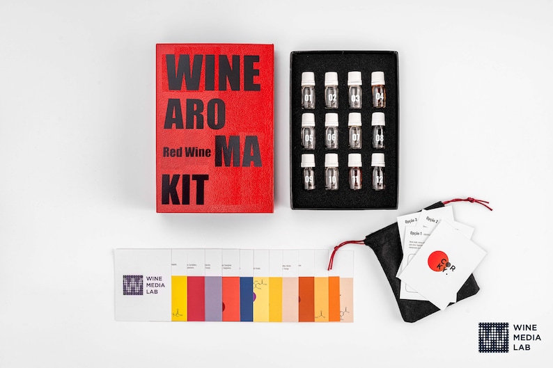 May include: Red Wine Aroma Kit with 12 small bottles of wine aroma scents, a color chart, and instructions. The kit is packaged in a red box with the text "Wine Aroma Kit" and "Red Wine".