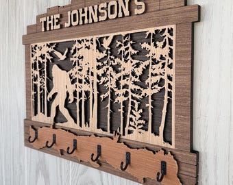 Personalized Rustic Wood Key Holder, New Home Housewarming Gift, Bigfoot Themed with with Tall Pine Forest. For homes, camps, RVs, Etc.