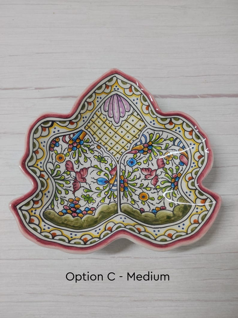 May include: A ceramic serving dish shaped like a leaf with a pink rim and intricate floral designs in shades of green, yellow, blue, and pink. The dish is divided into three sections. The text "Option C - Medium" is printed below the dish.