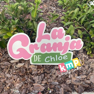 Decoraciones para fiestas con letrero de fondo de La Granja