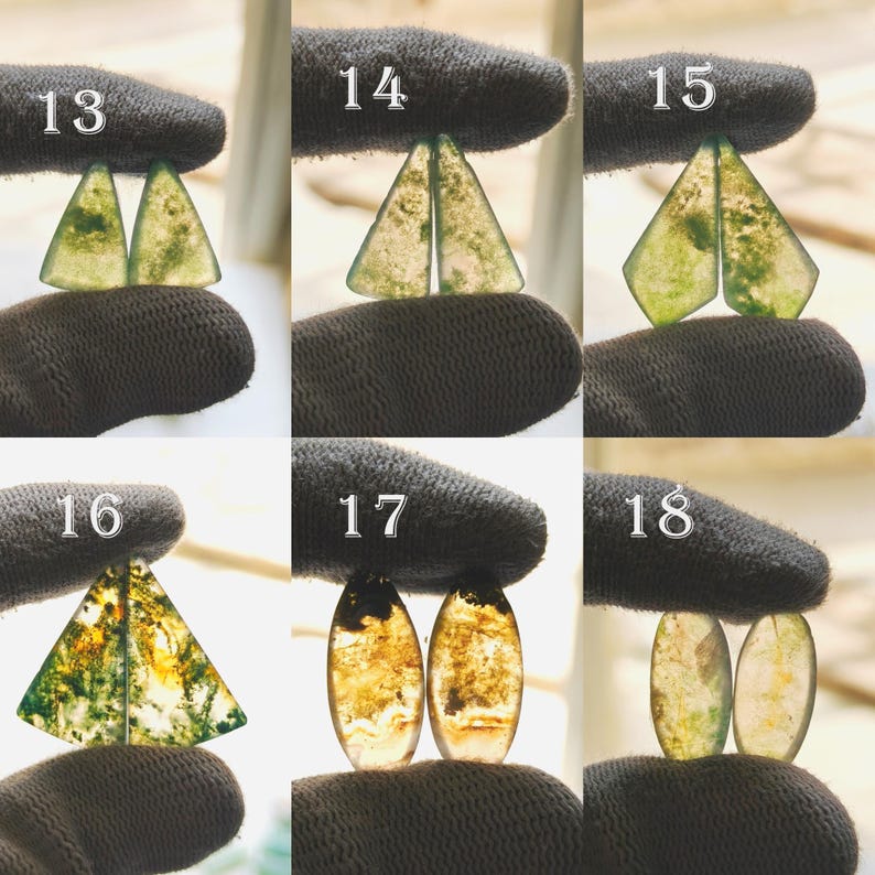 May include: A collection of six pairs of gemstone cabochons in various shapes and colors. The cabochons are held by a gloved hand. The gemstones have green, yellow, and brown inclusions. Each pair is numbered from 13 to 18.