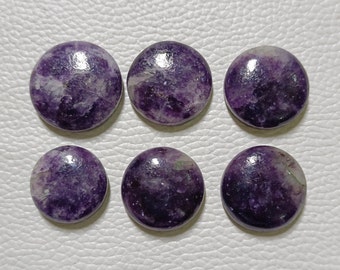 May include: Six round, polished gemstones in shades of purple and white. The stones are arranged in two rows of three, each with a smooth, glossy surface. The gemstones are likely for jewelry making.