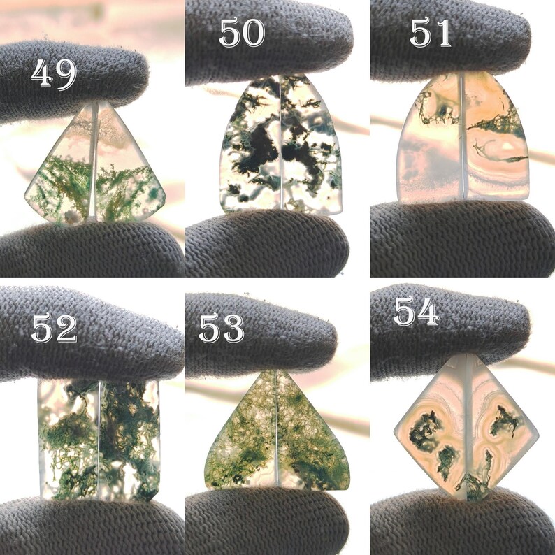 May include: Assortment of polished moss agate gemstone cabochons in various shapes, including triangles, rectangles, and diamonds. The stones display green, white, and translucent patterns. Each stone is held by a gloved hand, with numbers 49-54 visible.