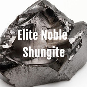 May include: A close-up of a dark gray, rough, and irregularly shaped piece of Elite Noble Shungite.