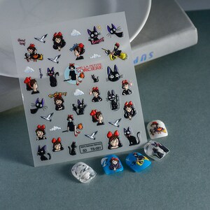 May include: A sheet of clear vinyl stickers featuring Kiki and Jiji from the movie Kiki's Delivery Service. The stickers feature various images of Kiki flying on her broomstick, Jiji the cat, and other scenes from the movie. The stickers are perfect for adding a touch of whimsy to laptops, water bottles, journals, and more.