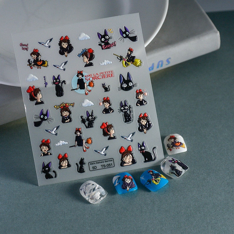 May include: A sheet of clear vinyl stickers featuring Kiki and Jiji from the movie Kiki's Delivery Service. The stickers feature various images of Kiki flying on her broomstick, Jiji the cat, and other scenes from the movie. The stickers are perfect for adding a touch of whimsy to laptops, water bottles, journals, and more.