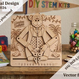 May include: A light-colored wooden educational toy featuring a monkey character with movable arms. The board displays the text Monkey Multiplier, a multiplication chart, and a number line from 1 to 12. The design includes palm trees and bananas.