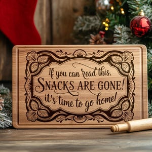 May include: A wooden cutting board with a festive Christmas design and the text "If you can read this, SNACKS ARE GONE! It's time to go home!"