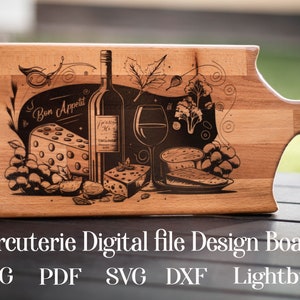 May include: A wooden cutting board with a laser-engraved design of a bottle of wine, grapes, cheese, and a glass of wine. The design includes the text "Bon Appetit".