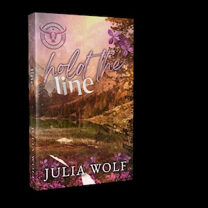 May include: A book cover with the title "hold the line" in a cursive font. The cover features a landscape with a lake and mountains, with purple flowers and the author's name, Julia Wolf, at the bottom. A logo with a bull's head is at the top.