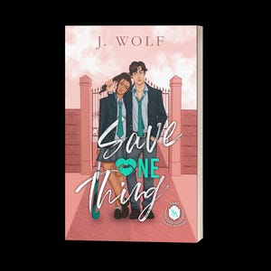 May include: A book cover featuring the title "Save One Thing" in white script over a teal heart. The cover art depicts two people in school uniforms, standing in front of a pink brick wall and gate. The author's name, J. Wolf, is at the top.