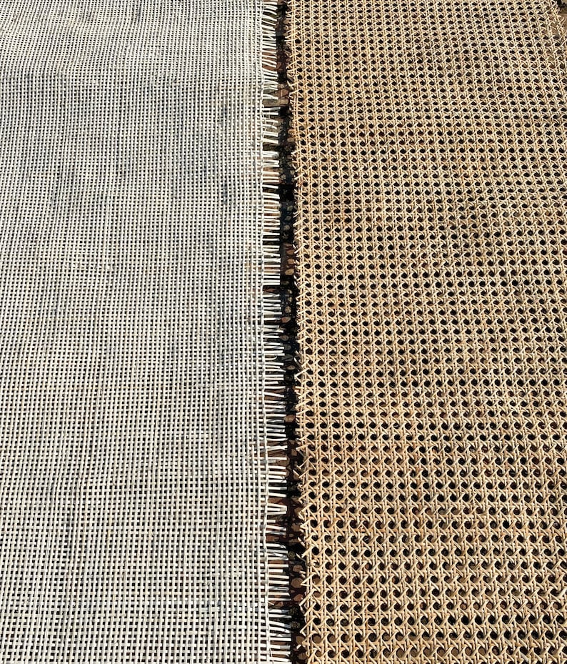 May include: Close-up of two different woven materials. On the left is a white, grid-like material. On the right is a tan, patterned material with small holes. The two materials are separated by a dark, fringed edge.