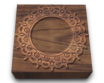 May include: A wooden plaque with a carved mandala design in a copper color. The mandala is a circular pattern with intricate details.