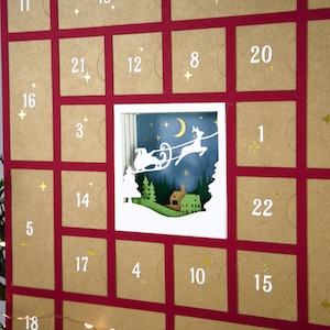 May include: A Christmas advent calendar with a red background and individual brown squares, each numbered. One square features a cut-out scene of Santa's sleigh. Gold star accents are scattered throughout the calendar.