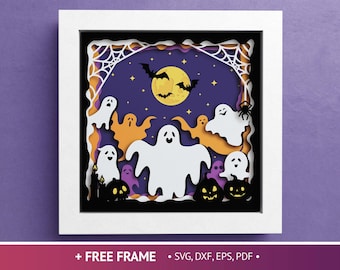 May include: A layered paper art piece in a white frame, featuring a Halloween scene. White ghosts, orange ghosts, and purple ghosts are set against a purple night sky with a full moon and bats. Black jack-o'-lanterns are at the bottom.