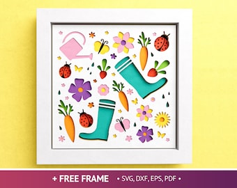 May include: A white frame with a colorful paper cut design inside. The design features a pair of green rain boots, carrots, ladybugs, butterflies, and flowers. The frame is perfect for adding a touch of spring to your home decor.