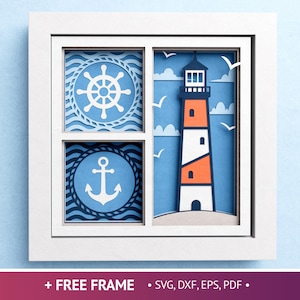 May include: A nautical-themed layered paper art piece in a white frame. The design features a ship's wheel, an anchor, and a lighthouse with orange and white stripes. Includes the text "+ FREE FRAME".