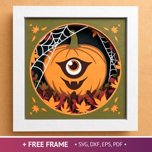 May include: A papercraft design featuring a jack-o'-lantern with a single eye and a toothy grin, surrounded by autumn leaves and a spiderweb.