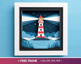 May include: A papercraft frame with a red and white lighthouse with a beam of light shining from the top. The lighthouse is set against a blue night sky with white clouds and stars. The frame is made of white cardstock and has a black border.